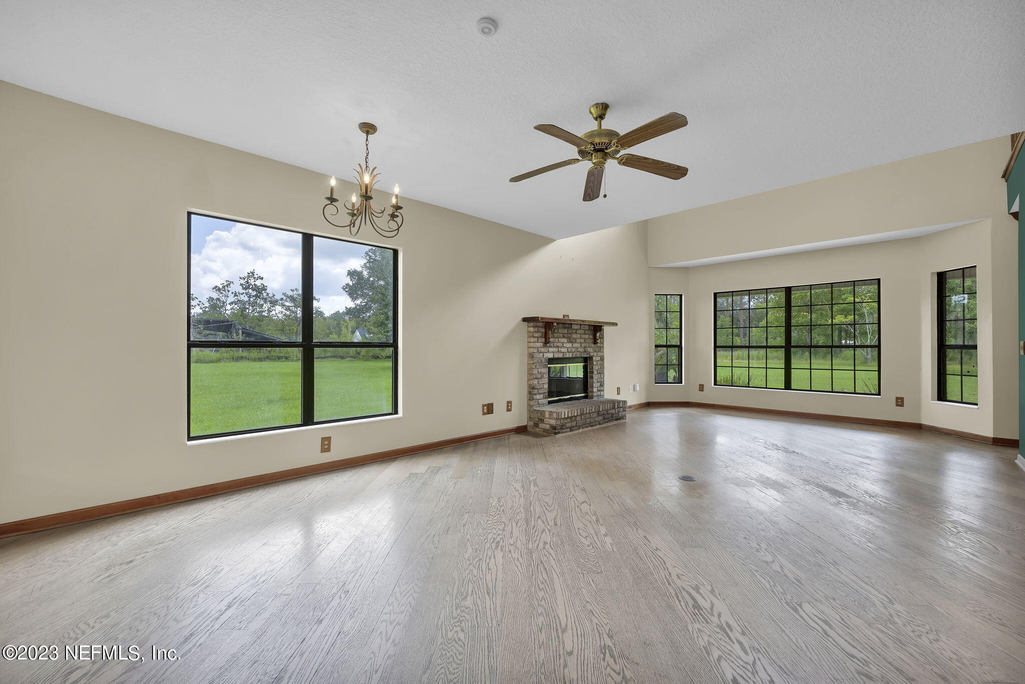 1387 Lee Road St. Johns, FL 32259 - Photo 16 of 62 a view of empty room with wooden floor and fan