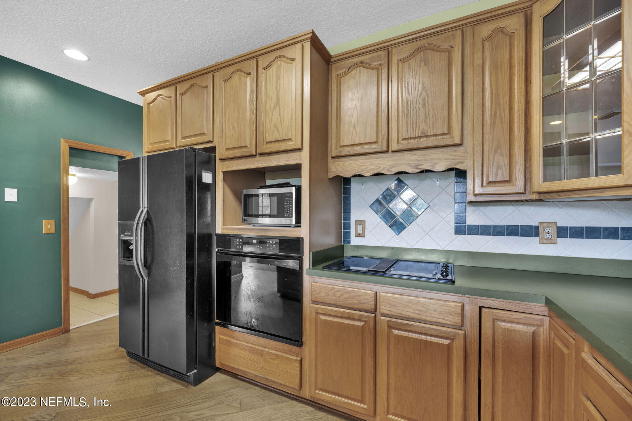 1387 Lee Road St. Johns, FL 32259 - Photo 20 of 62 a kitchen with stainless steel appliances granite countertop a refrigerator and a sink