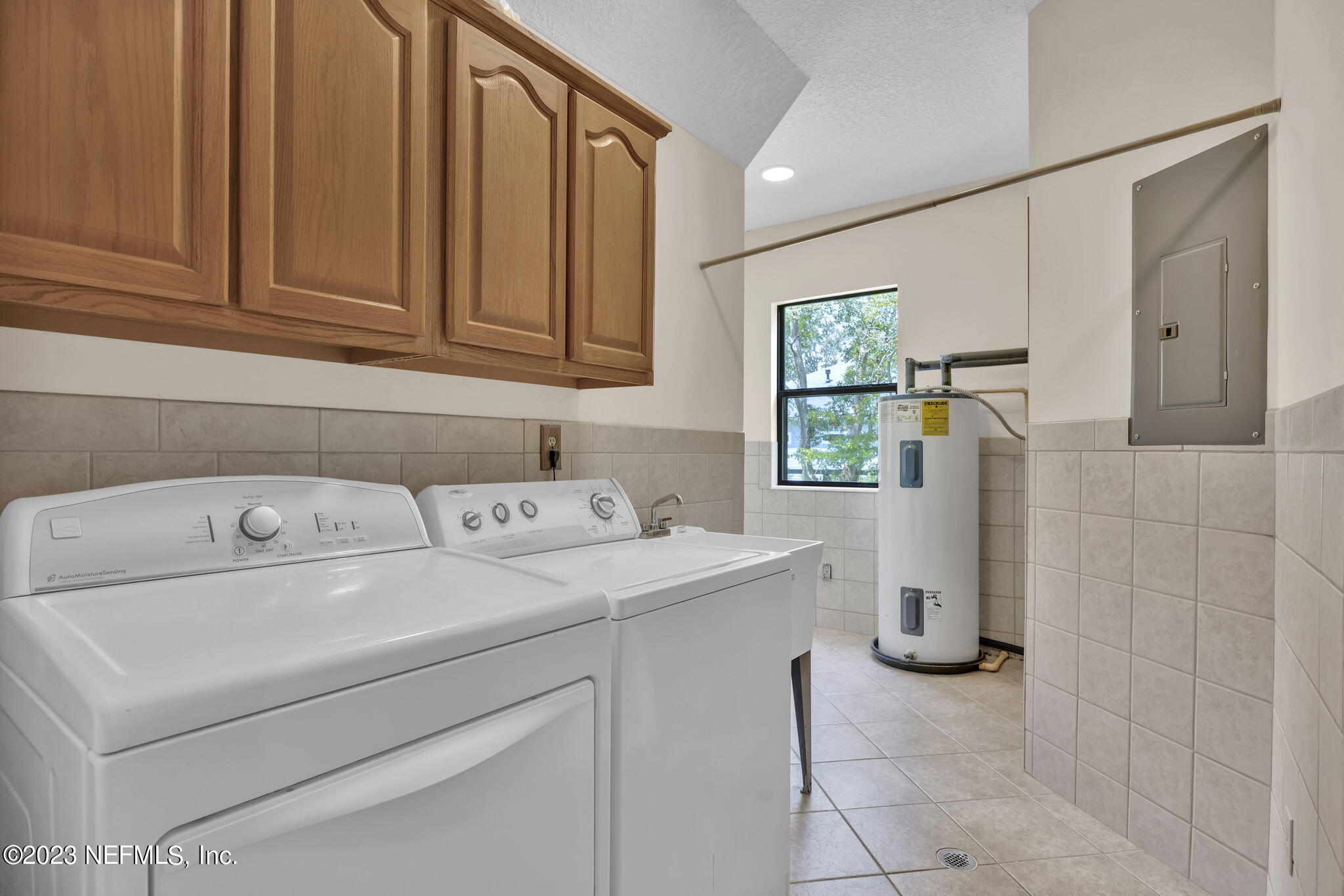 1387 Lee Road St. Johns, FL 32259 - Photo 25 of 62 a utility room with dryer and washer