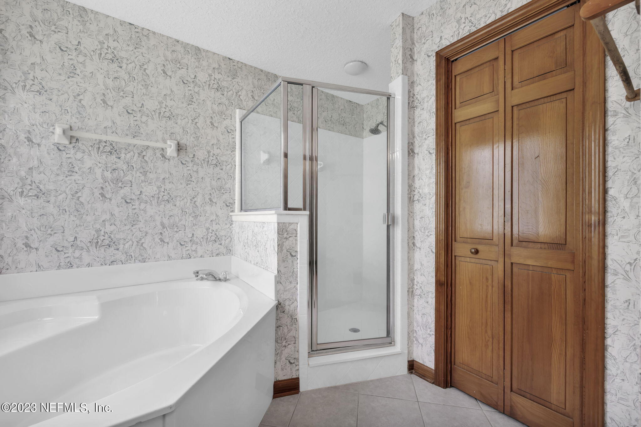 1387 Lee Road St. Johns, FL 32259 - Photo 33 of 62 a bathroom with a bathtub and a shower