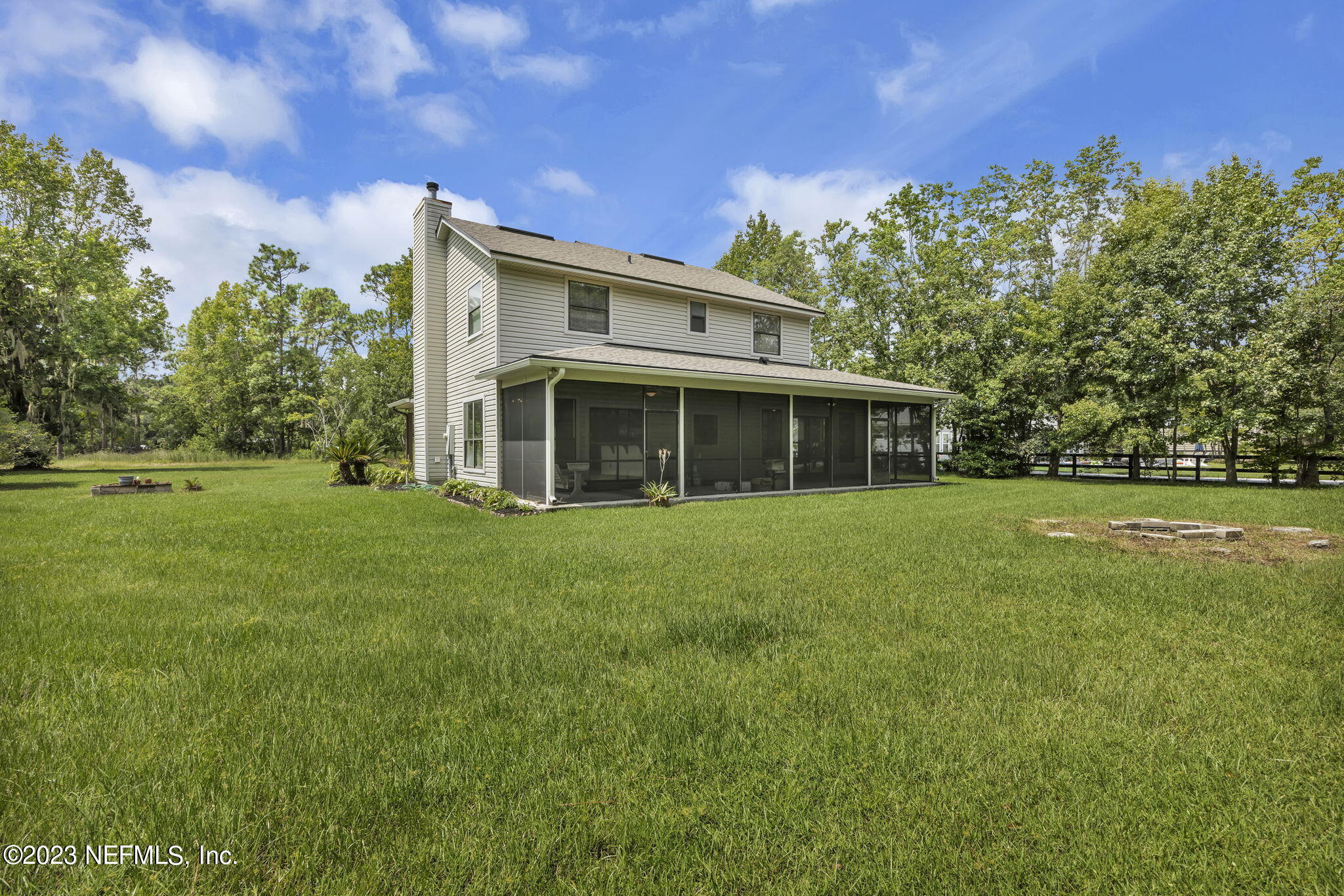 1387 Lee Road St. Johns, FL 32259 - Photo 39 of 62 a front view of a house with a garden