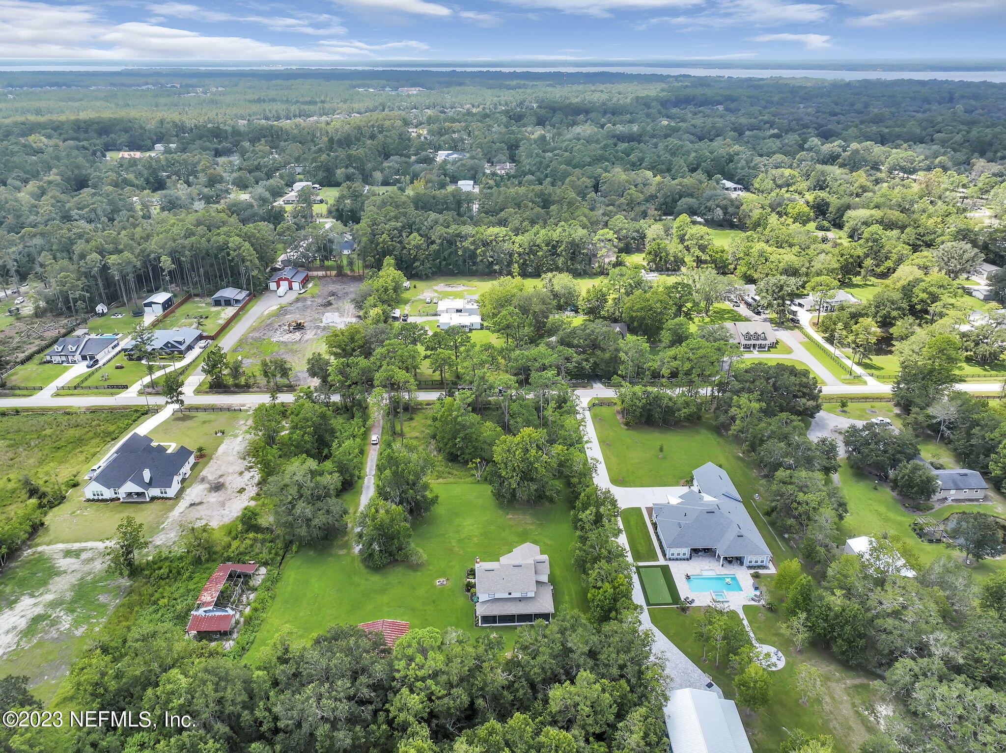 1387 Lee Road St. Johns, FL 32259 - Photo 47 of 62 an aerial view of residential house with outdoor space and lake view