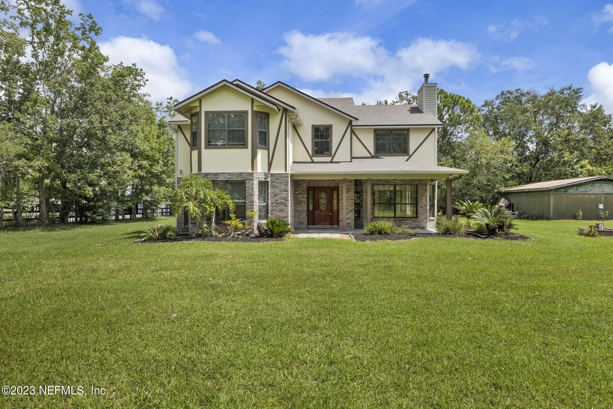 1387 Lee Road St. Johns, FL 32259 - Photo 5 of 62 a front view of a house with a garden