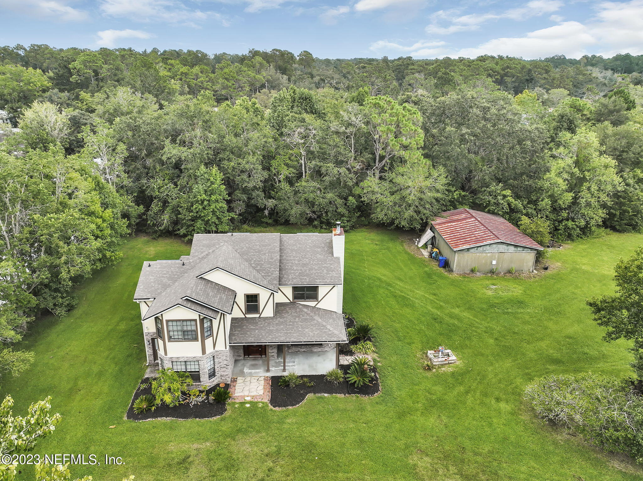 1387 Lee Road St. Johns, FL 32259 - Photo 56 of 62 an aerial view of a house with a yard