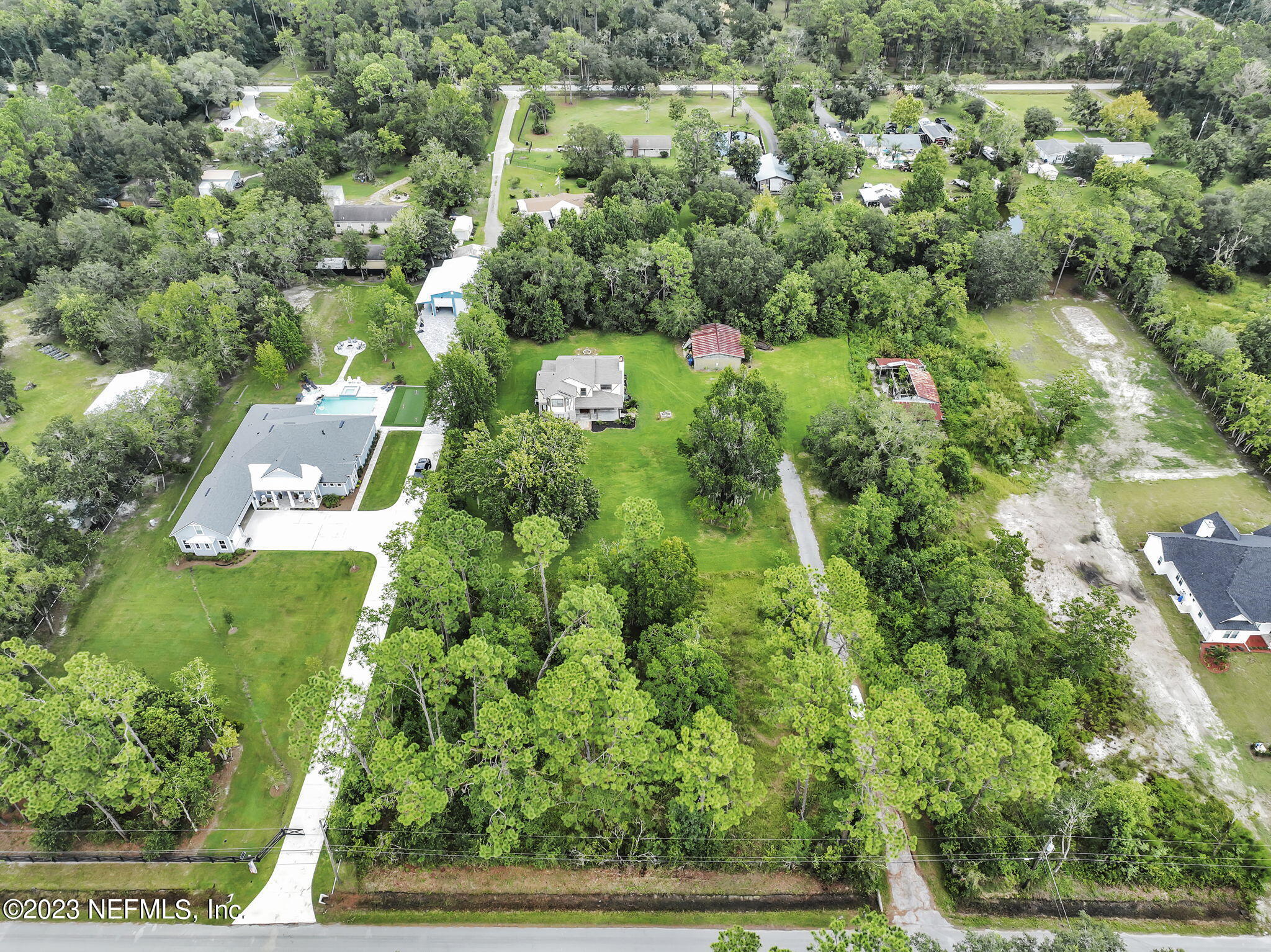 1387 Lee Road St. Johns, FL 32259 - Photo 59 of 62 an aerial view of residential house with outdoor space and trees all around