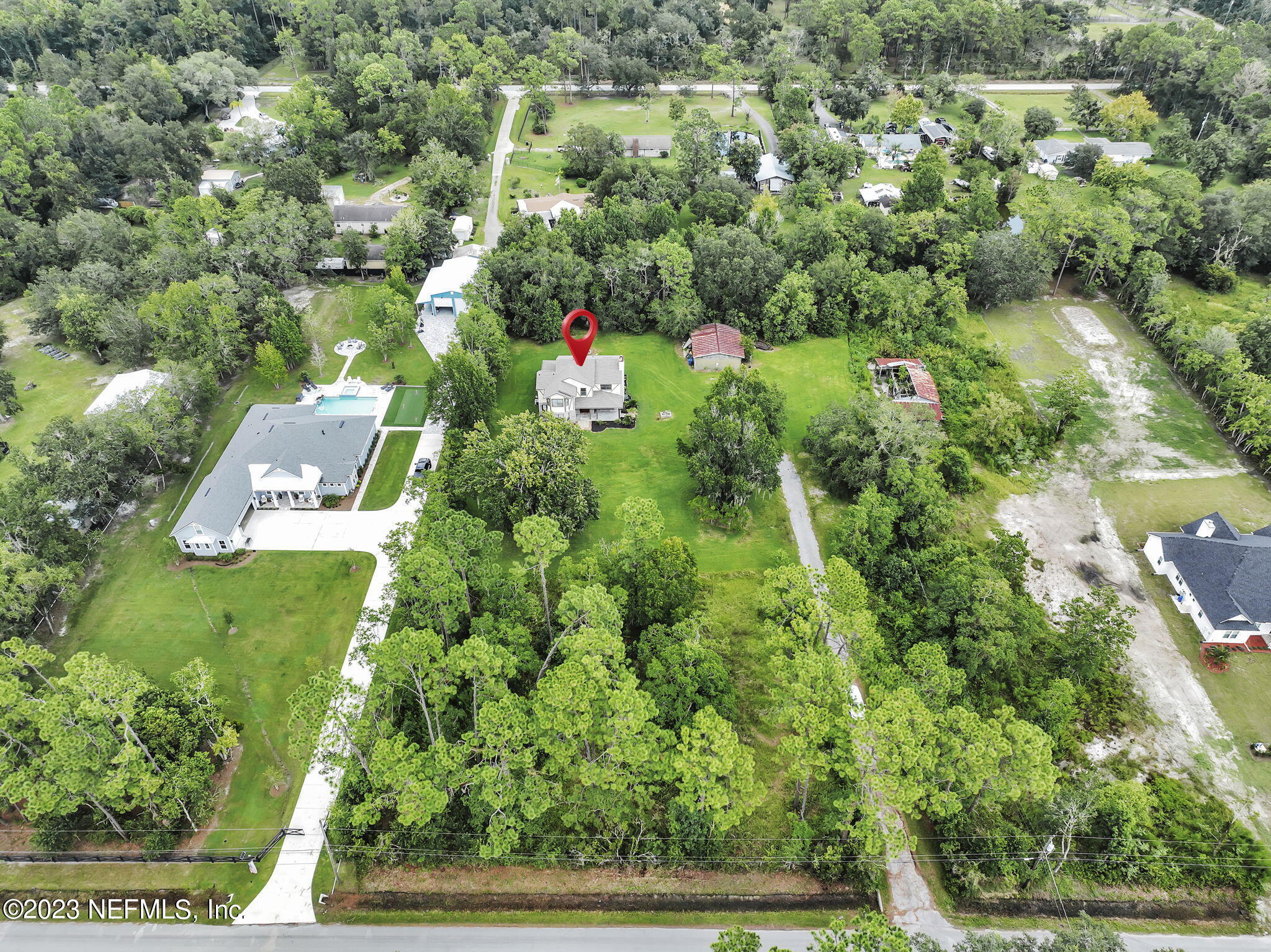1387 Lee Road St. Johns, FL 32259 - Photo 60 of 62 an aerial view of residential house with outdoor space and trees all around