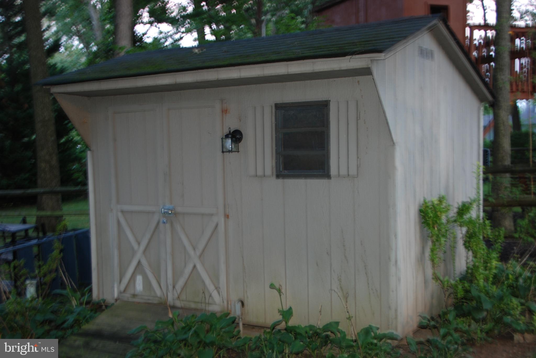 6909 Banbury Road Baltimore, MD 21239 - Photo 14 of 14 Shed for storing lawnmower and other items