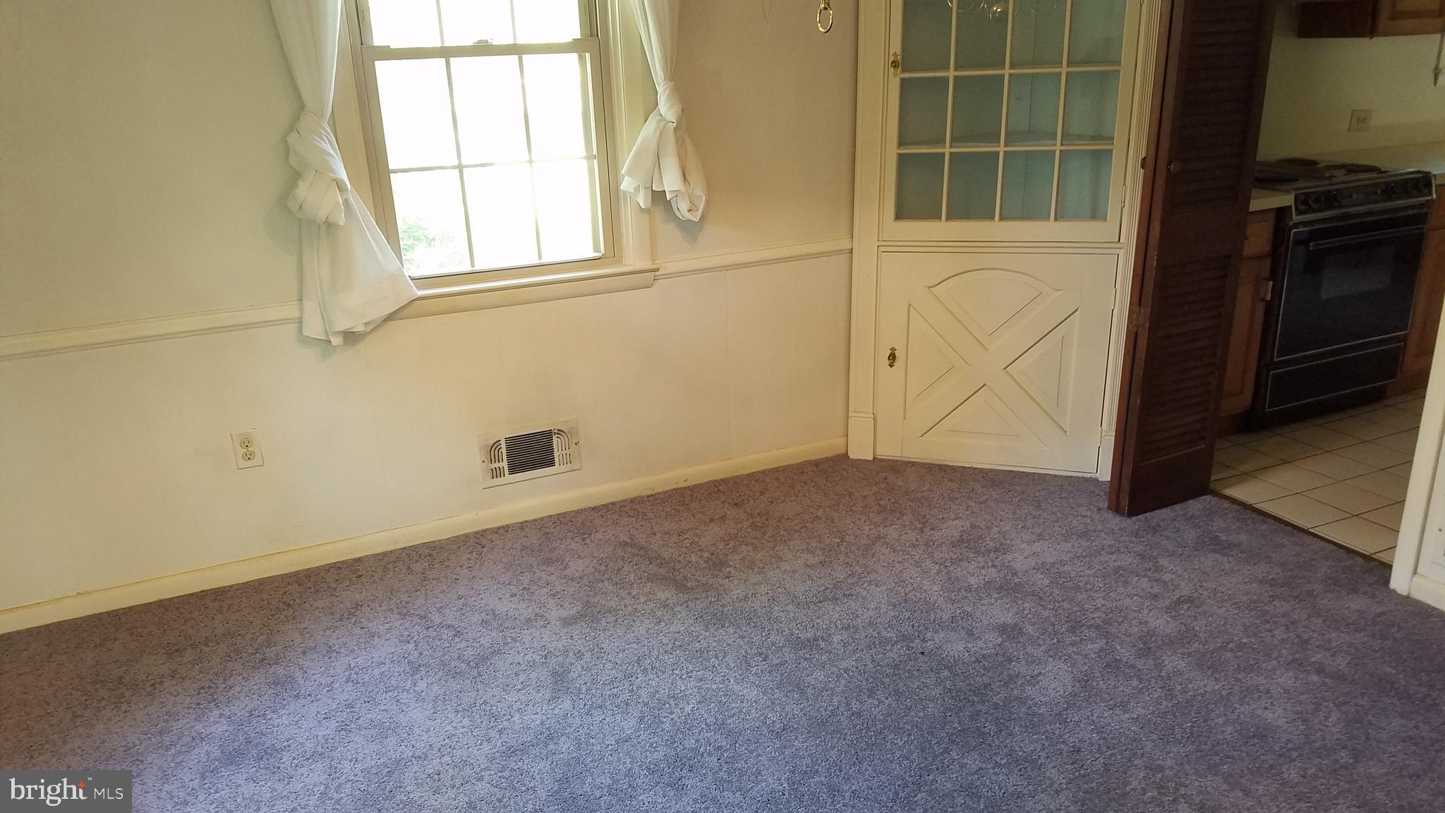 6909 Banbury Road Baltimore, MD 21239 - Photo 4 of 14 Dining Room with new carpet.