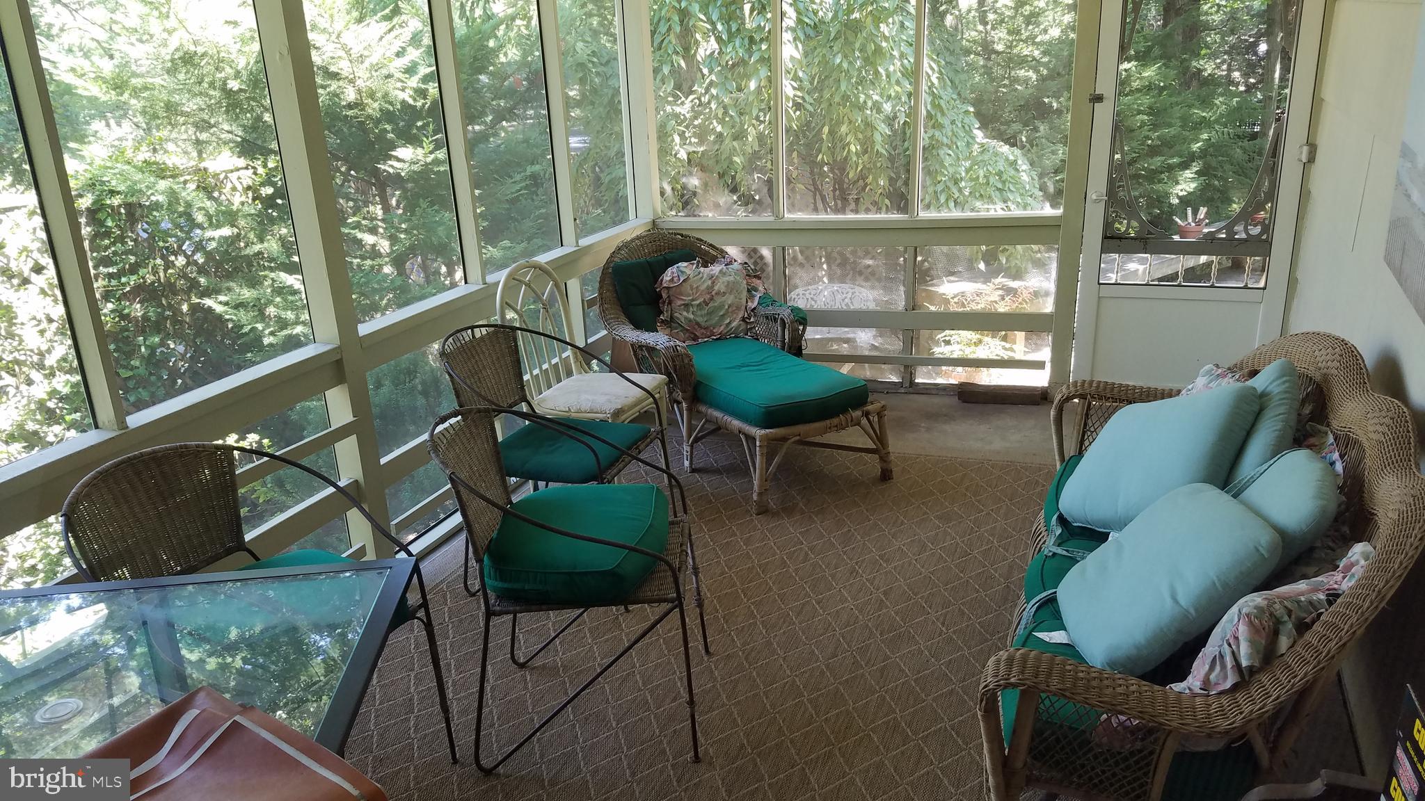 6909 Banbury Road Baltimore, MD 21239 - Photo 6 of 14 Screened in porch off kitchen area.