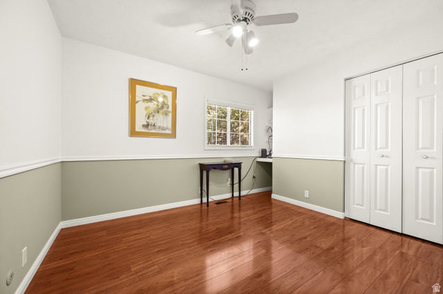 1650 Nichole Circle Sandy, UT 84093 - Photo 18 of 31 Room featuring rich wood-finish flooring, a ceiling fan with integrated lighting, and dual bifold closet doors