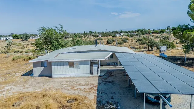 a aerial view of a house with a yard
