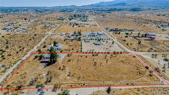 an aerial view of house with yard