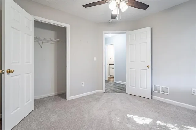 an empty room with fan