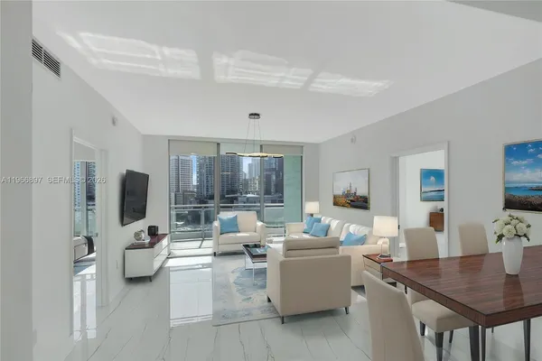 a living room with furniture and a large window