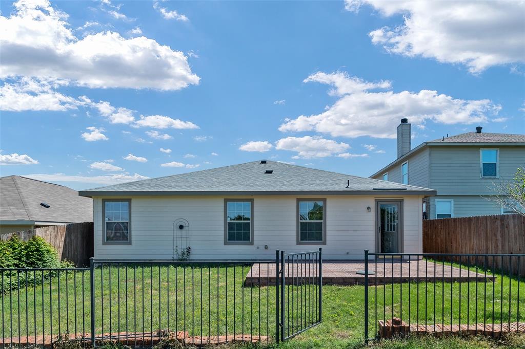 3917 Mantis Street Fort Worth, TX 76106 - Photo 22 of 22 a front view of a house with a garden and plants