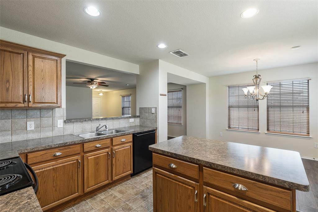 3917 Mantis Street Fort Worth, TX 76106 - Photo 3 of 22 a view of a kitchen counter space and windows