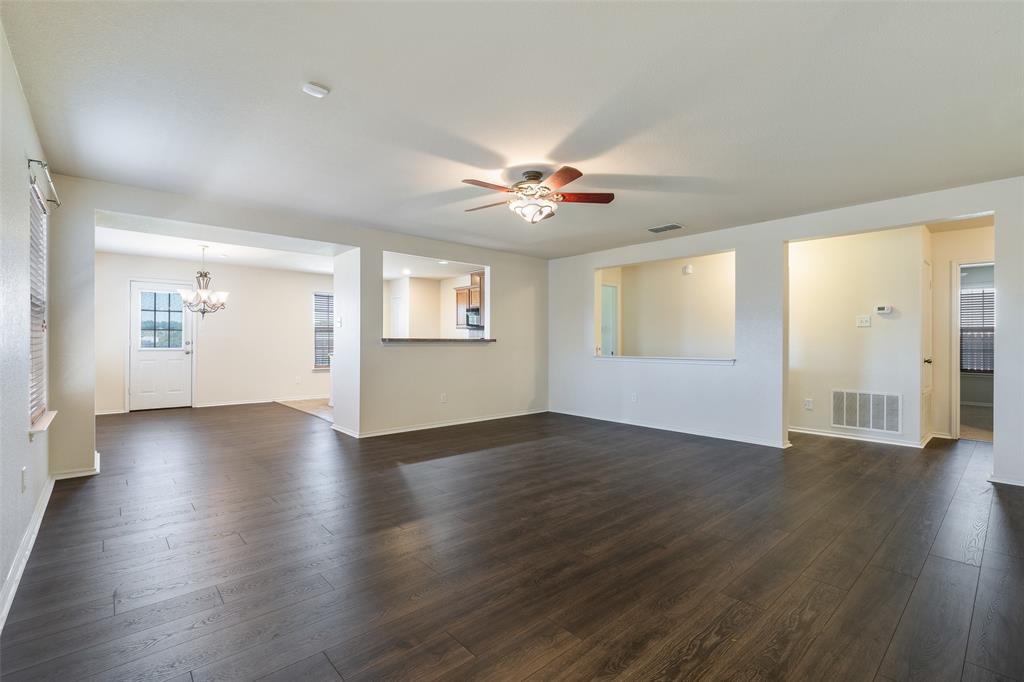 3917 Mantis Street Fort Worth, TX 76106 - Photo 6 of 22 a view of an empty room with window and wooden floor
