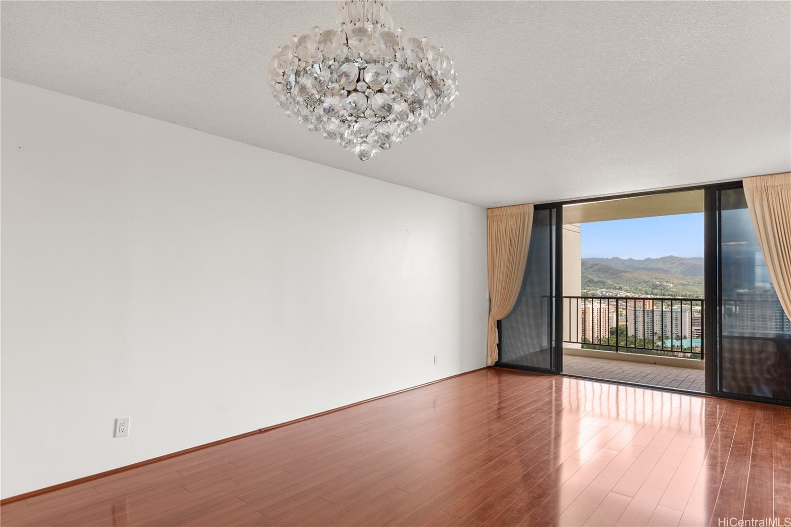 990 Ala Nanala Street, Unit 32C Honolulu, HI 96818 - Photo 2 of 24 Living Room to Lanai