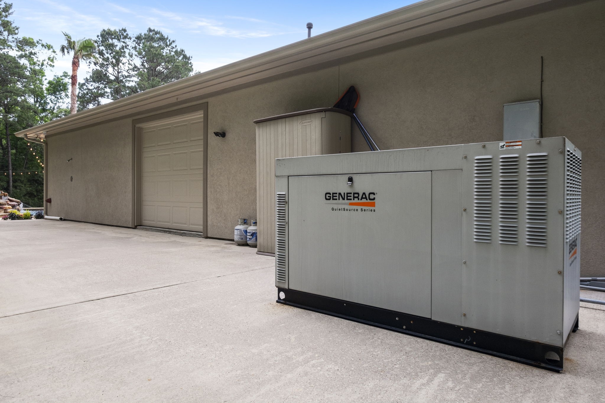20010 Timber Ridge Drive Magnolia, TX 77355 - Photo 41 of 50 The 36kW generator is able to fully power the main home, pool and 9-car garage and is located on the back side of the garage.