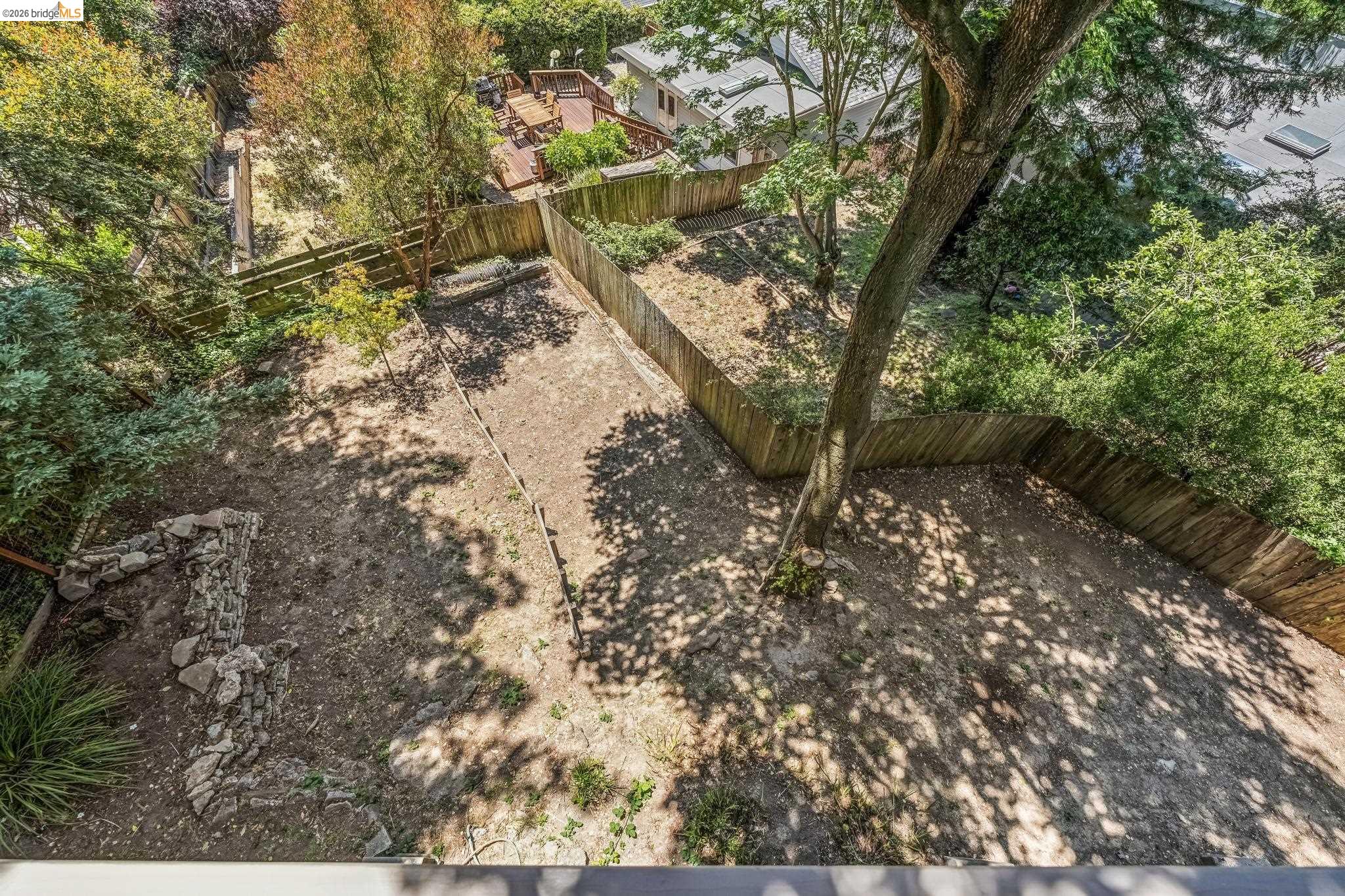 6645 Heather Ridge Way Oakland, CA 94611 - Photo 55 of 61 Expansive outdoor area featuring mature trees and established perimeter fencing