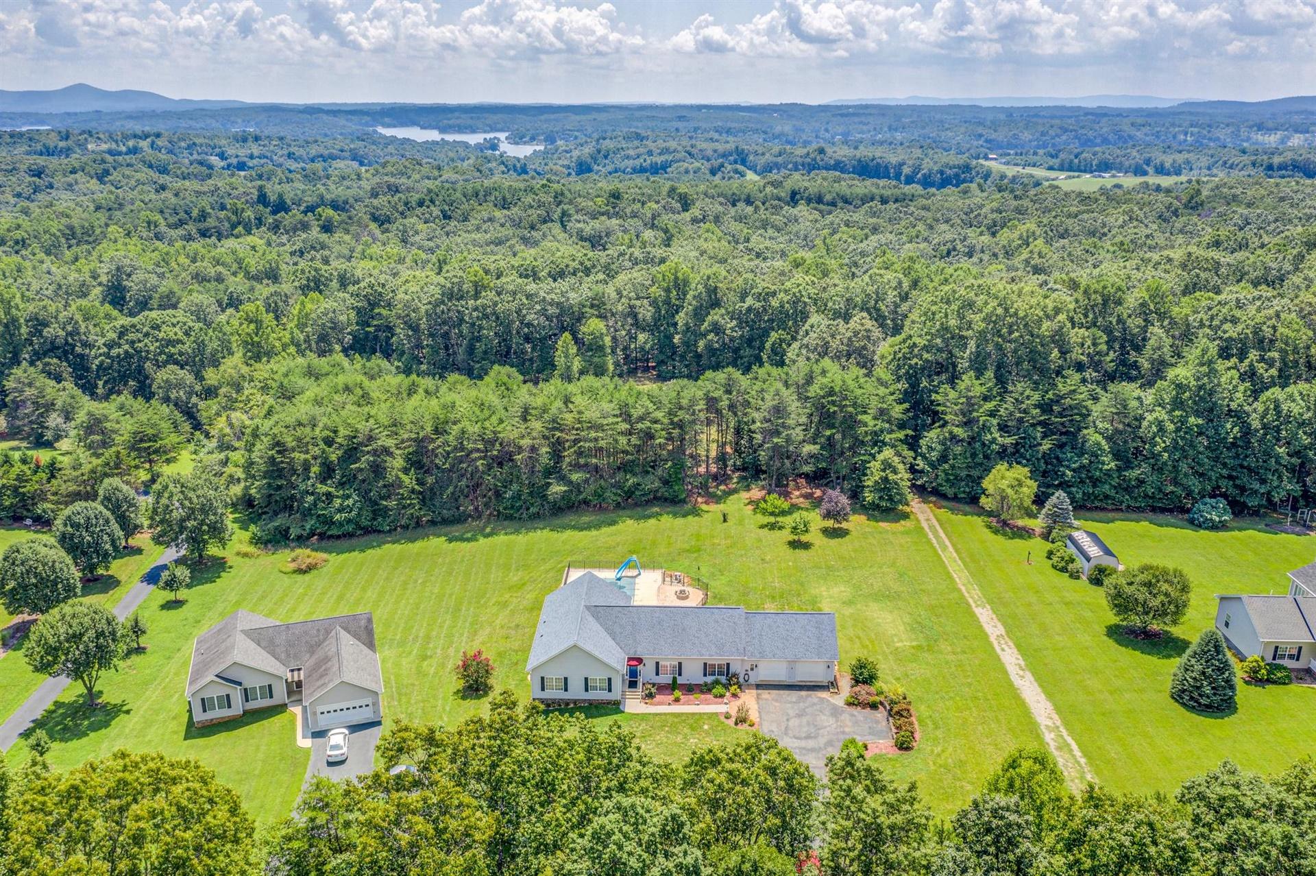 340 Mallard Point Road Wirtz, VA 24184 - Photo 2 of 41 an aerial view of a house with a swimming pool