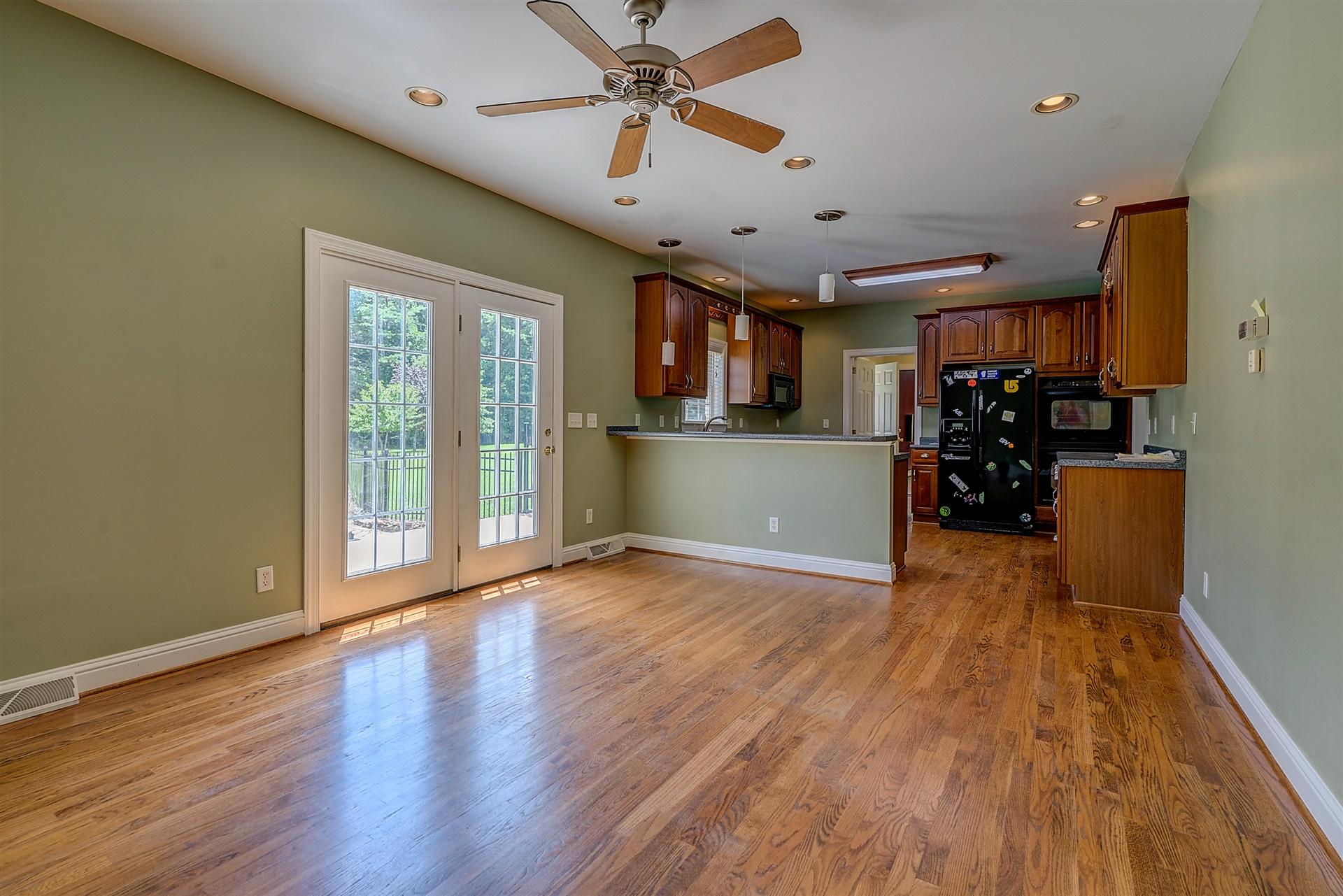 340 Mallard Point Road Wirtz, VA 24184 - Photo 20 of 41 a view of a livingroom with furniture wooden floor and a ceiling fan