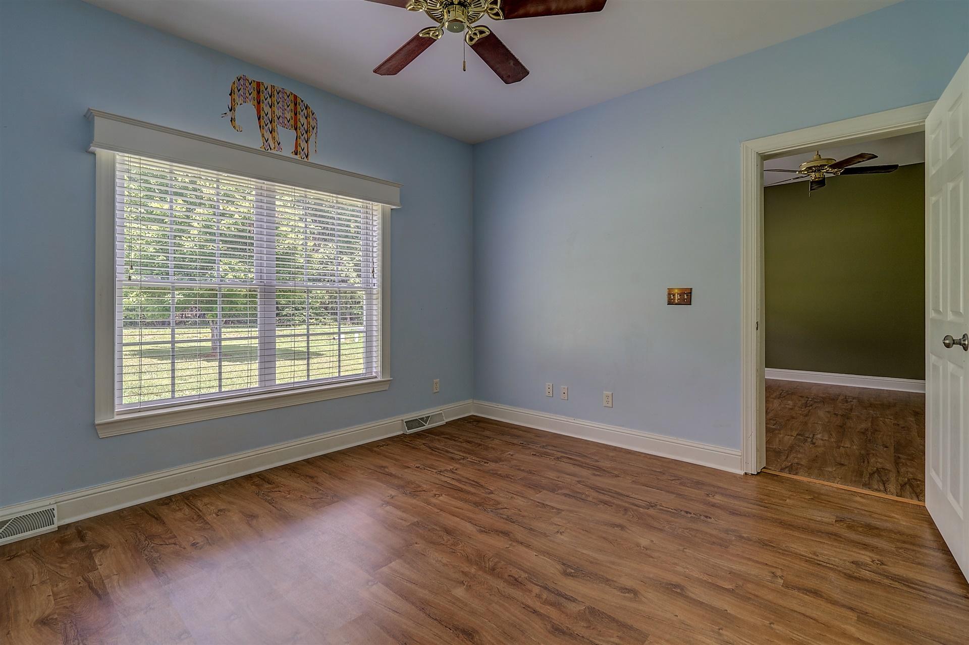 340 Mallard Point Road Wirtz, VA 24184 - Photo 22 of 41 an empty room with wooden floor fan and windows