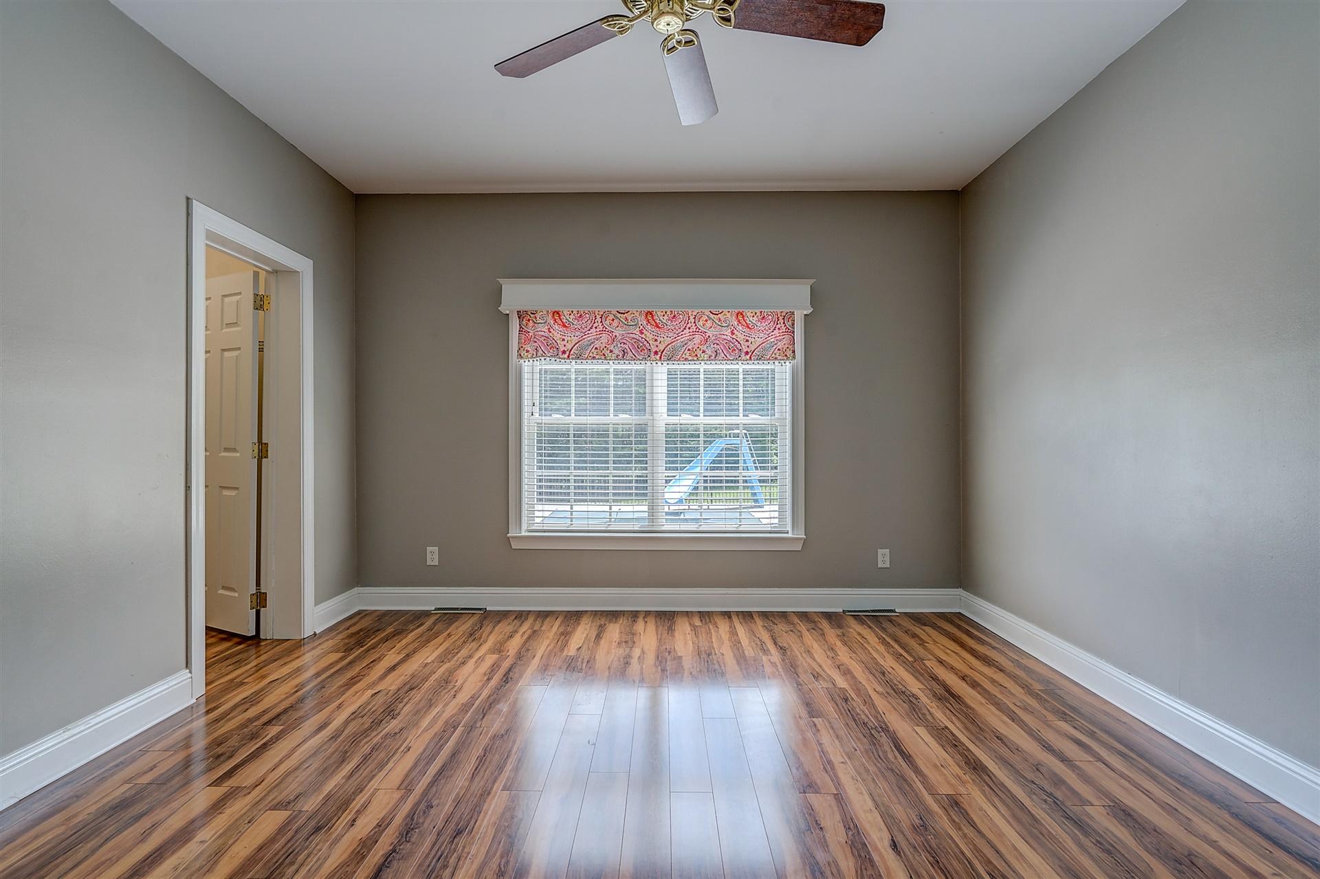 340 Mallard Point Road Wirtz, VA 24184 - Photo 30 of 41 a view of an empty room with wooden floor and a window