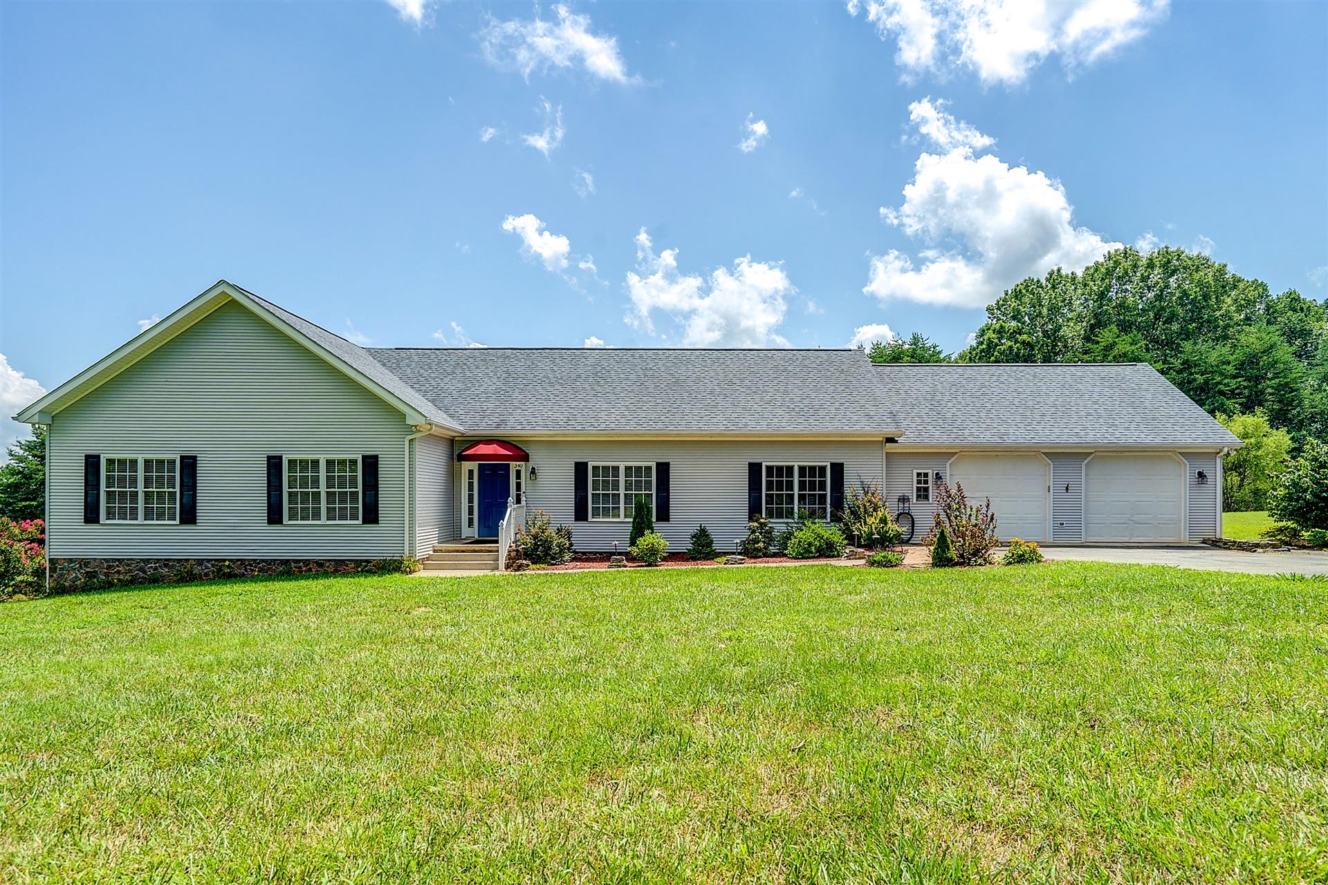 340 Mallard Point Road Wirtz, VA 24184 - Photo 32 of 41 a view of a house with a yard and potted plants
