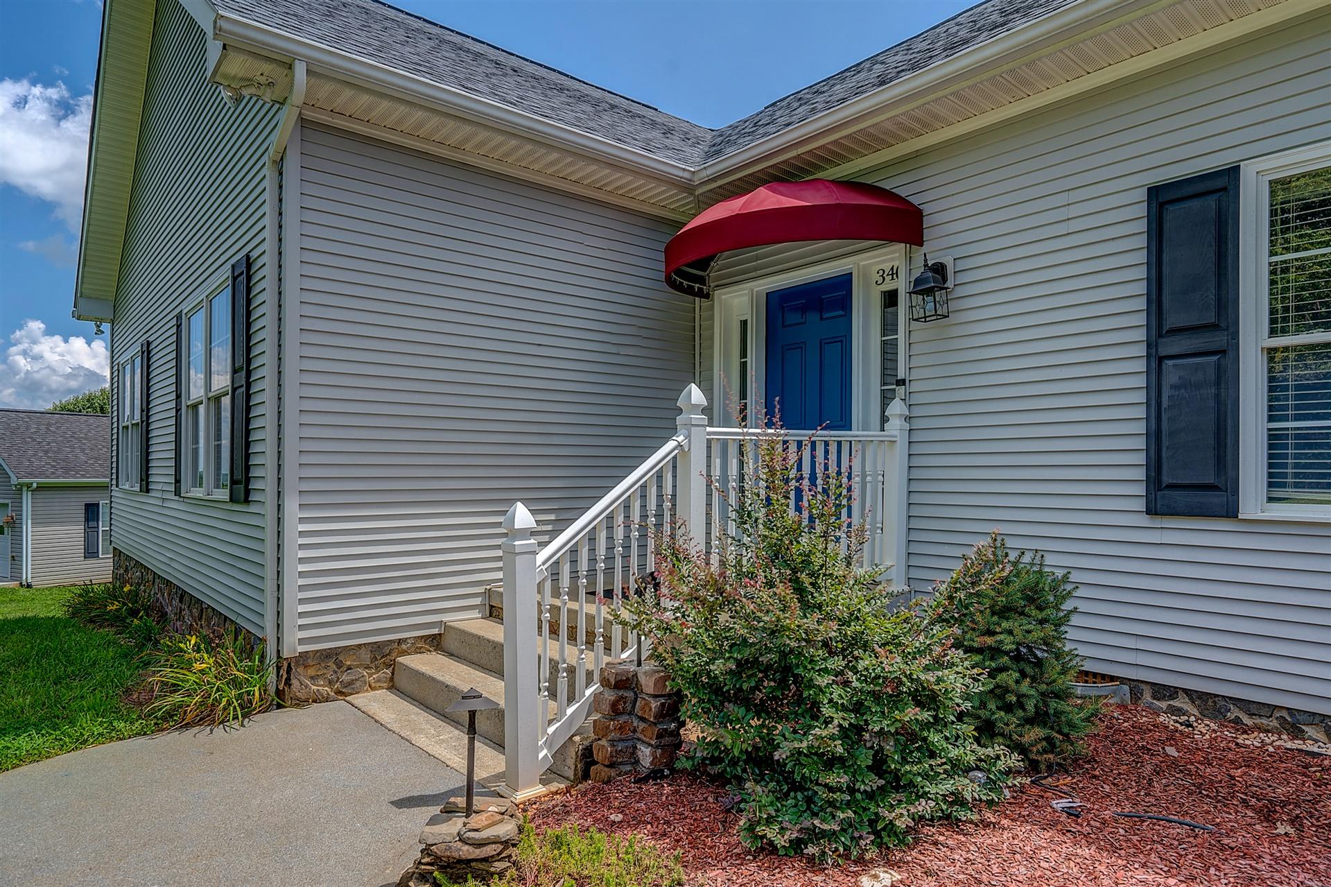 340 Mallard Point Road Wirtz, VA 24184 - Photo 6 of 41 a view of a house with a small deck and a small yard