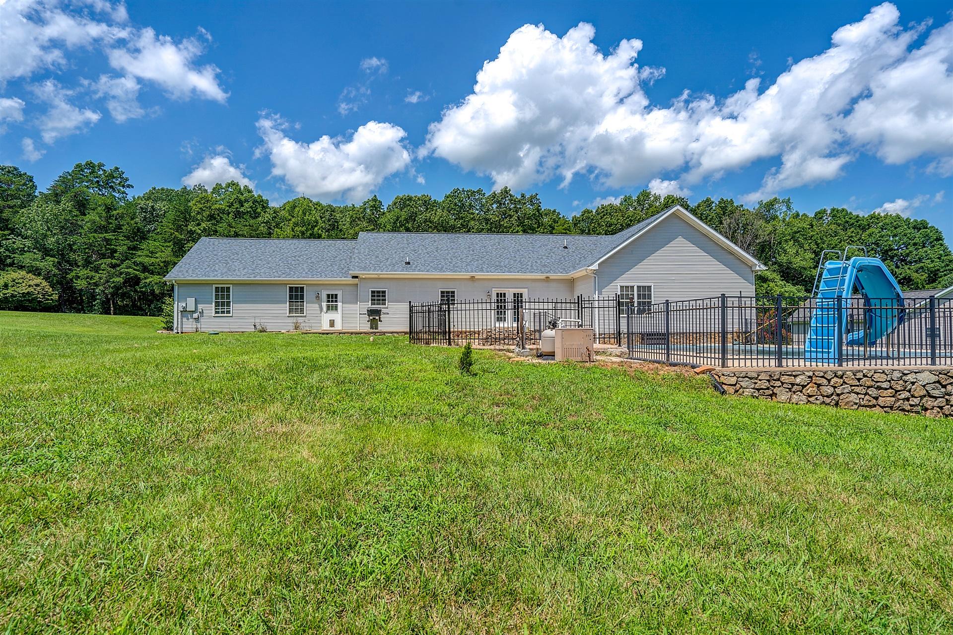 340 Mallard Point Road Wirtz, VA 24184 - Photo 7 of 41 a view of house with backyard and garden