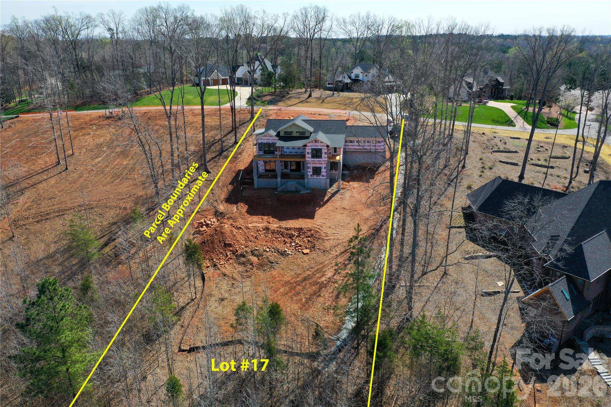 7047 Ridgeview Lane, Unit 17 Iron Station, NC 28080 - Photo 15 of 18 a view of a wooden deck with chairs and a yard