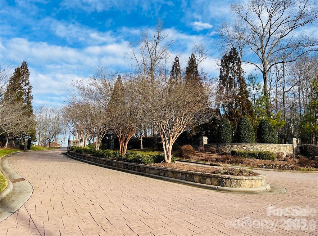 7047 Ridgeview Lane, Unit 17 Iron Station, NC 28080 - Photo 5 of 18 a view of road with trees