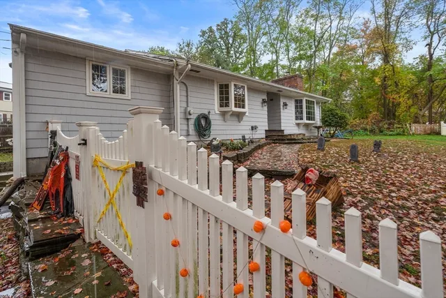 a backyard of a house with yard and outdoor seating