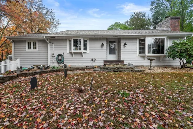 a backyard of a house with seating space