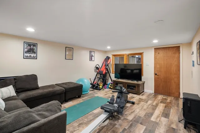 a view of a kitchen with stainless steel appliances granite countertop a sink and cabinets