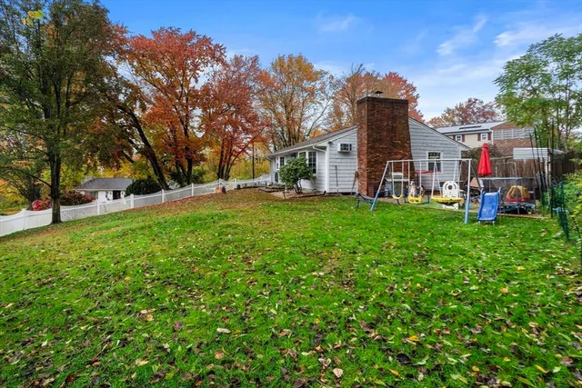 a view of outdoor sitting area with furniture and wooden fence