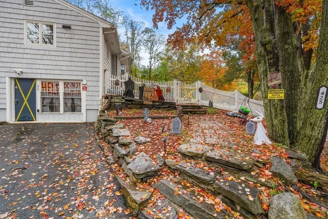 a view of a pathway with a wooden fence