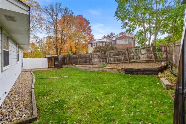 a view of a backyard with sitting area