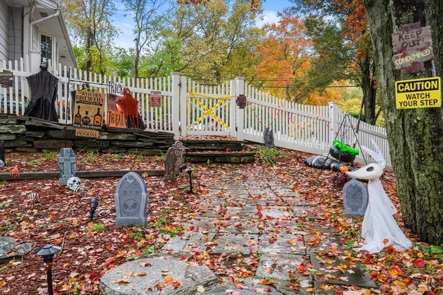 a kitchen with granite countertop cabinets stainless steel appliances a sink and a window