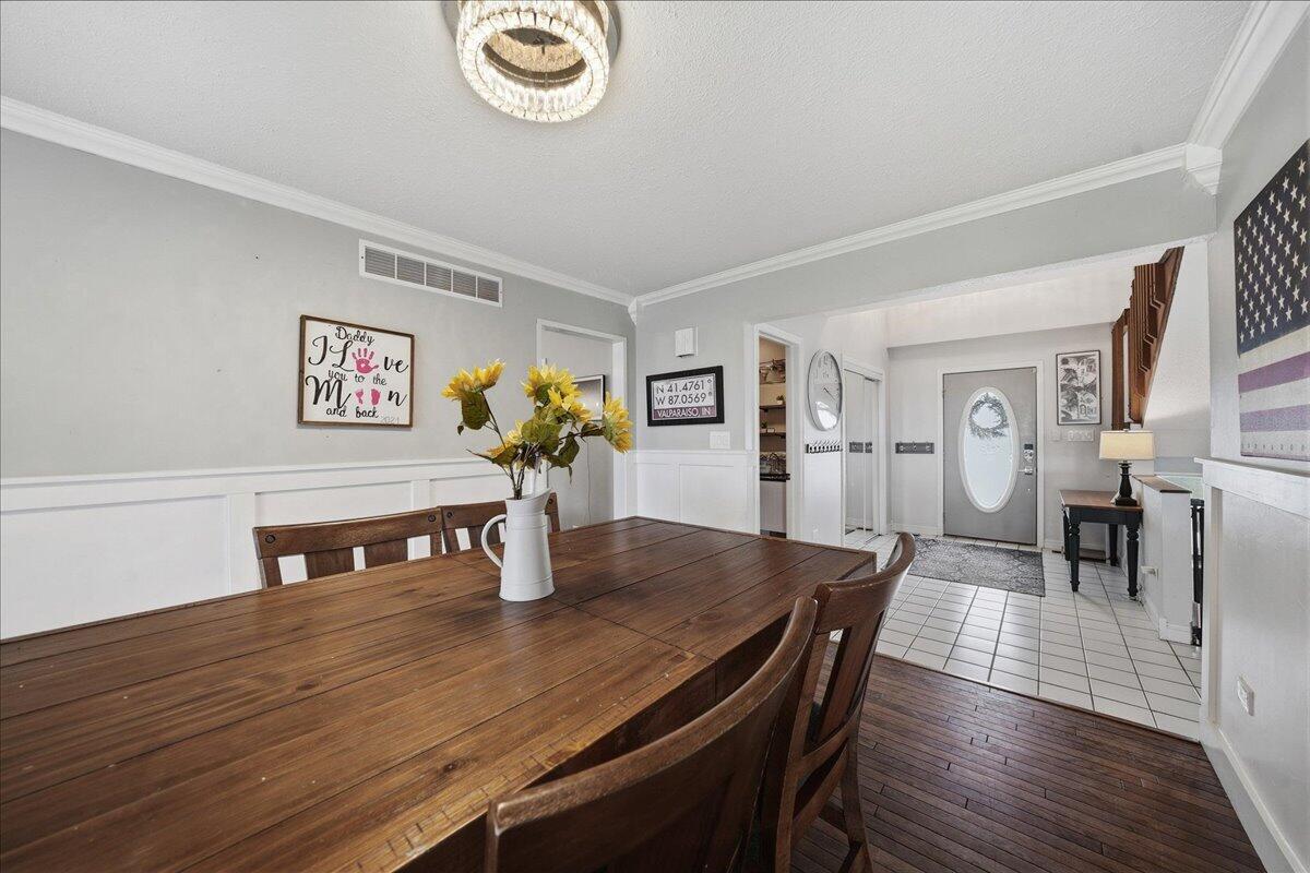 426 Laurel Lane Valparaiso, IN 46385 - Photo 13 of 48 a view of a dining room with furniture and wooden floor