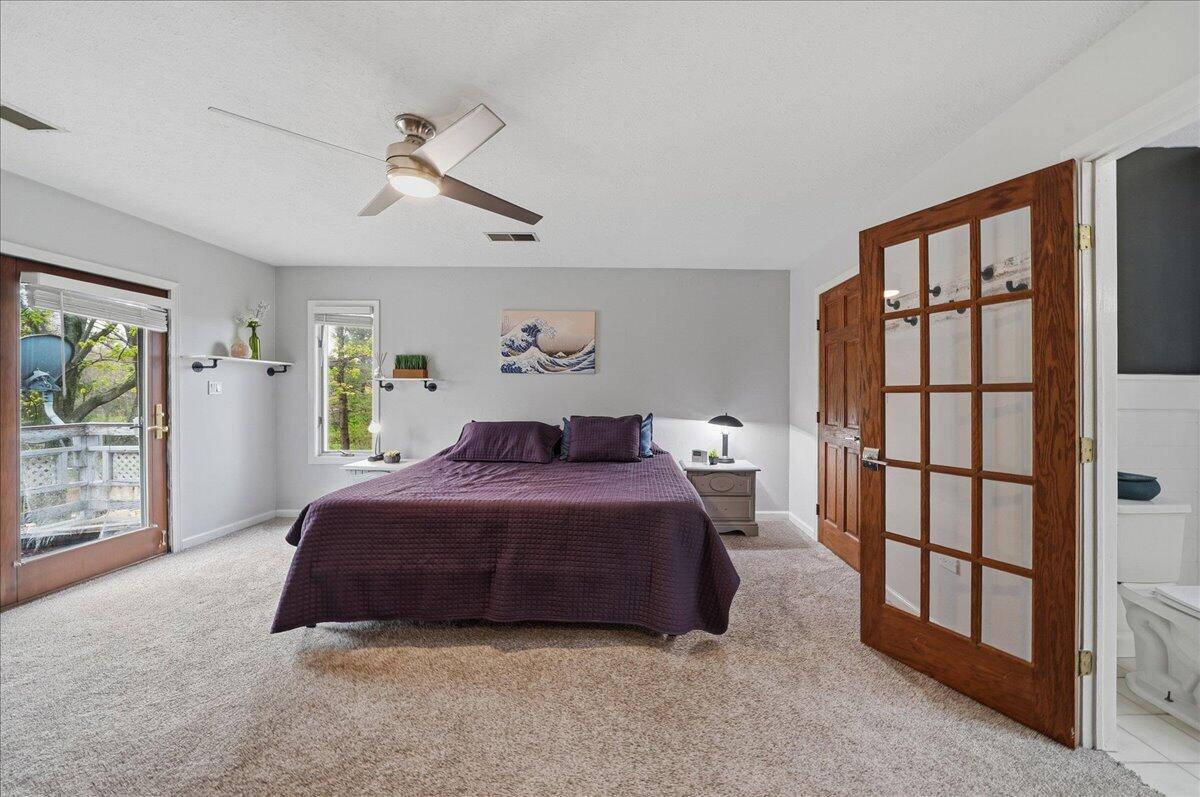 426 Laurel Lane Valparaiso, IN 46385 - Photo 23 of 48 a spacious bedroom with a bed and a window