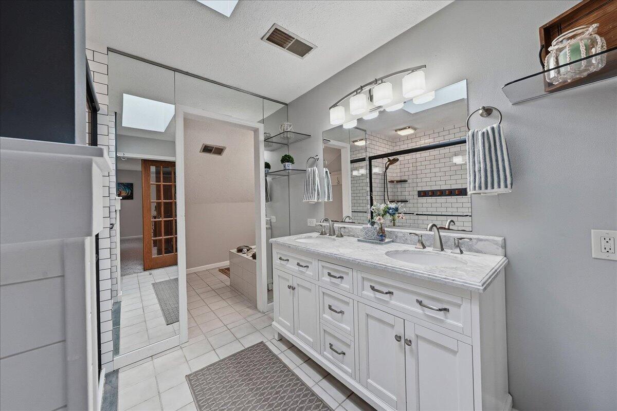 426 Laurel Lane Valparaiso, IN 46385 - Photo 25 of 48 a bathroom with a double vanity sink and mirror