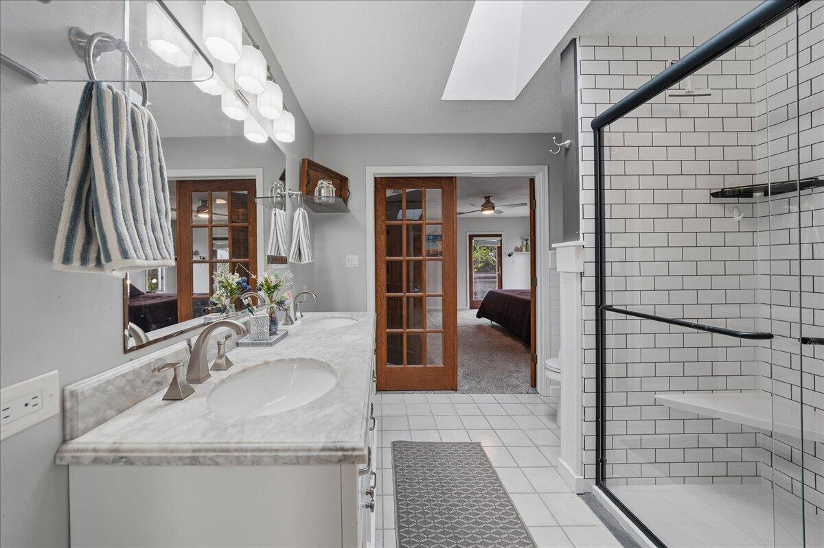 426 Laurel Lane Valparaiso, IN 46385 - Photo 27 of 48 a bathroom with a sink a vanity and a mirror