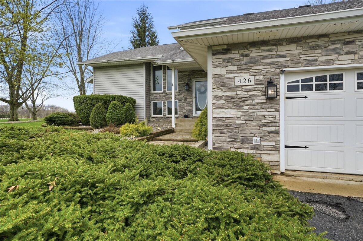 426 Laurel Lane Valparaiso, IN 46385 - Photo 3 of 48 a view of a house with a large window and plants