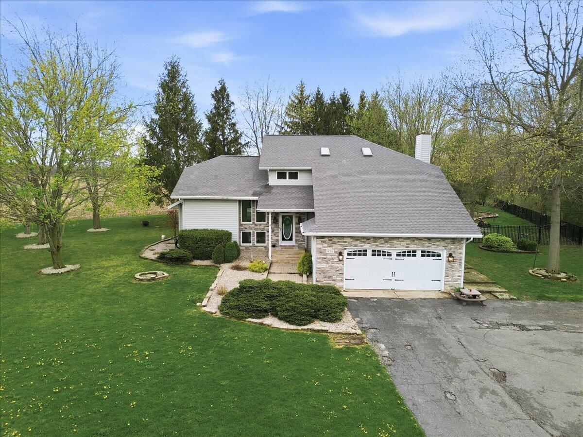 426 Laurel Lane Valparaiso, IN 46385 - Photo 48 of 48 a aerial view of a house next to a big yard and large trees