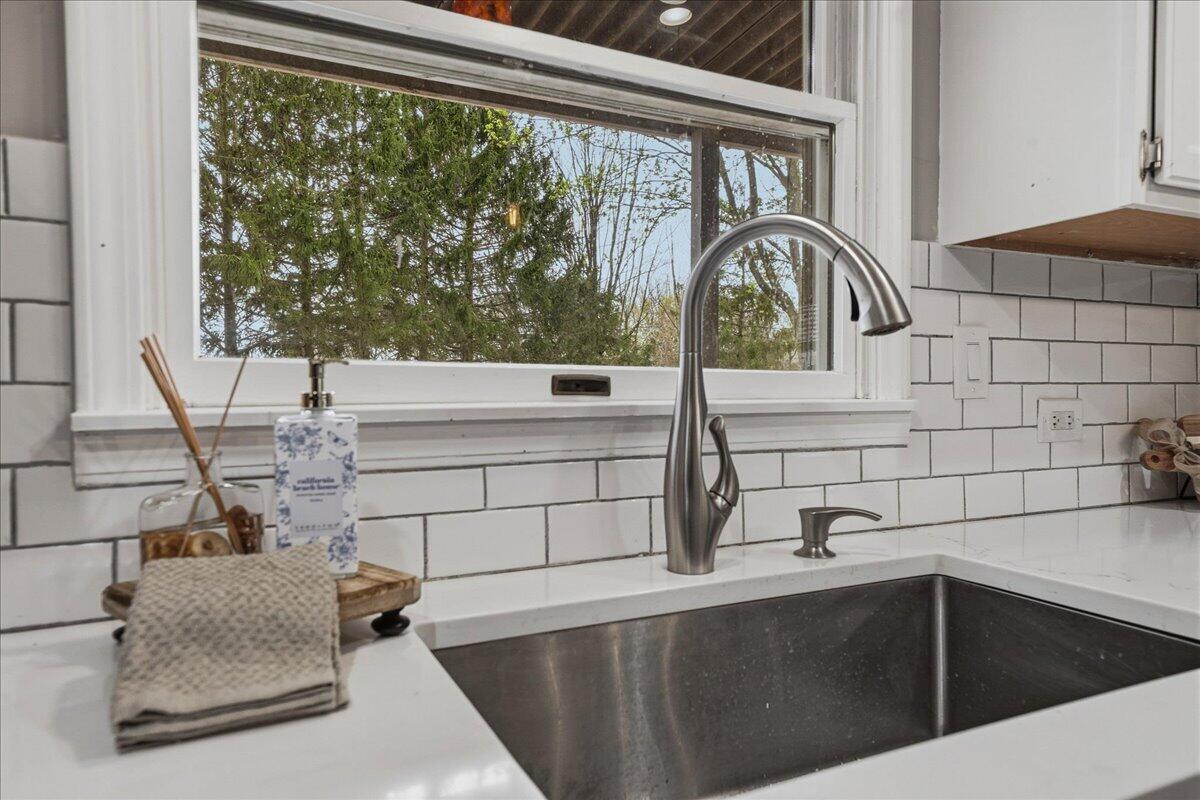 426 Laurel Lane Valparaiso, IN 46385 - Photo 9 of 48 a kitchen with a sink and a large window