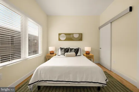 a bedroom with a bed and window