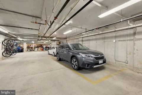 a view of parking garage with cars