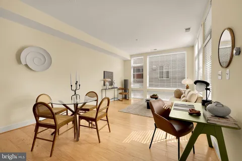 a dining room with furniture and window